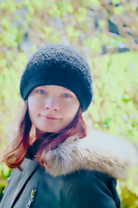 Portrait of young woman in hat