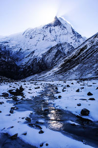 View of the nepalese mountains and river at sunrise. mountain winter landscape. annapurna base camp.