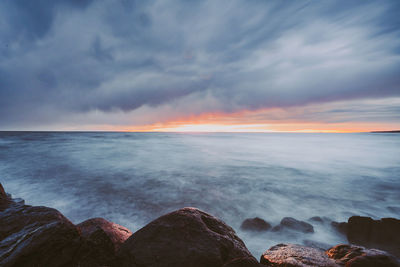 Scenic view of sea against sky at sunset