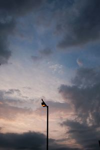 Low angle view of street light against sky