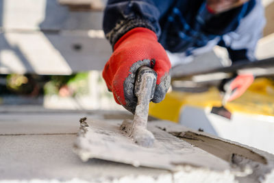 Low section of person working on outdoors