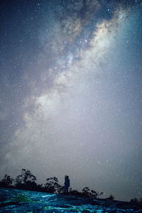 Scenic view of sea against sky at night