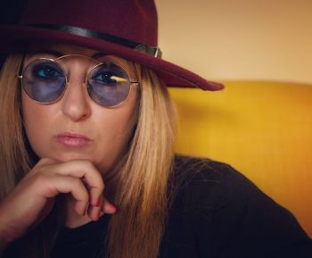 Close-up portrait of woman wearing sunglasses