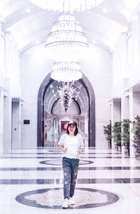 Full length of man standing outside building