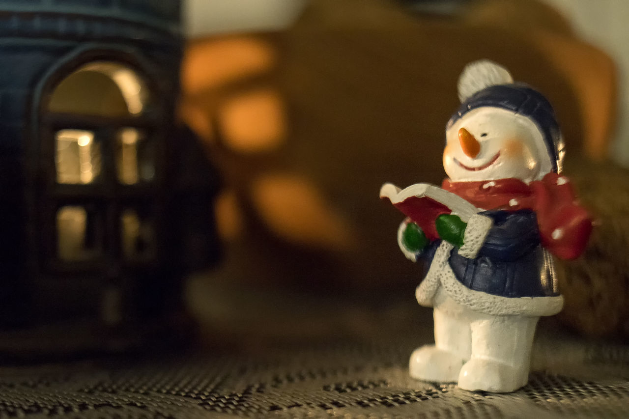 CLOSE-UP OF STUFFED TOY ON TABLE AT HOME