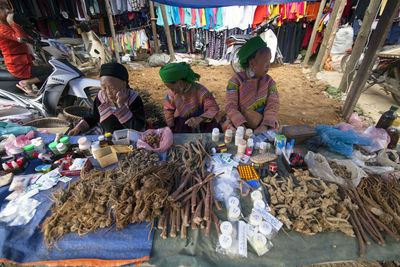 Group of people at market stall