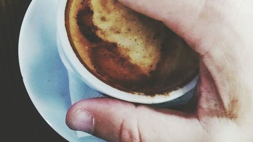 Midsection of woman holding ice cream in plate