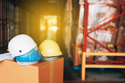 Close-up of hardhats on box