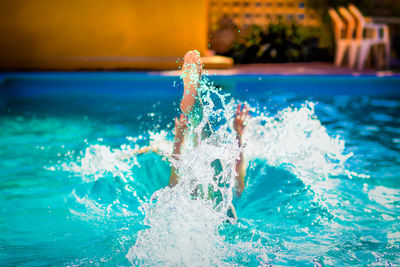 Close-up of person swimming in pool