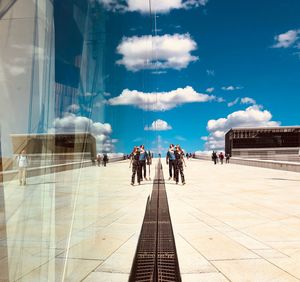 Group of people in front of modern building