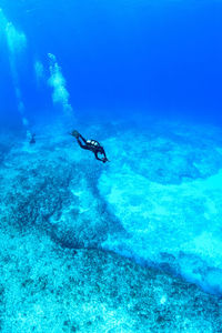 Person swimming in sea