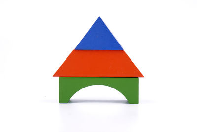 Close-up of colored pencils over white background