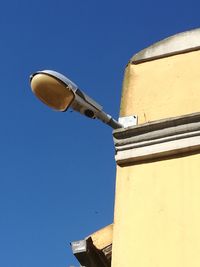 Low angle view of building against blue sky