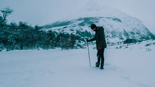 Man skiing on snowcapped mountain