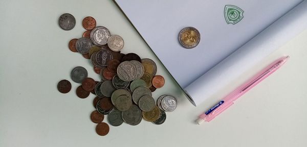 High angle view of coins on table