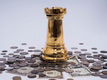 Close-up of coins on table against white background