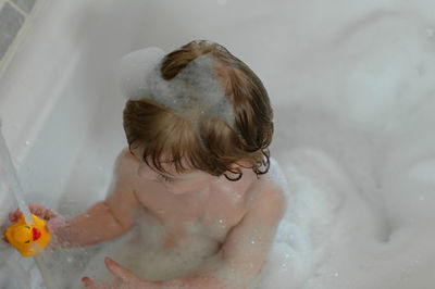 High angle view of boy in bathroom at home