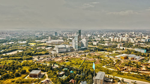 High angle view of buildings in city against sky