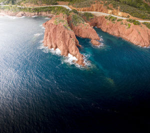 High angle view of rocks by sea