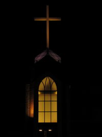 Low angle view of illuminated window in building