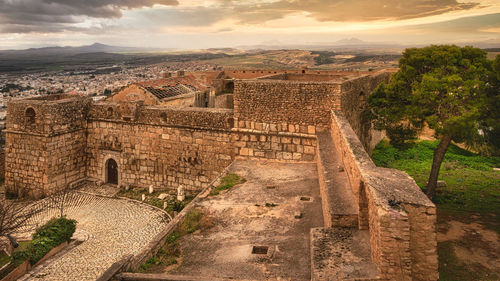 Old ruins against sky during sunset
