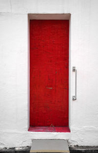Red closed door of house
