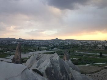 Scenic view of landscape against cloudy sky