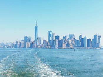 Modern buildings in city against clear sky