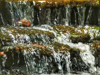 Close-up of water flowing in river