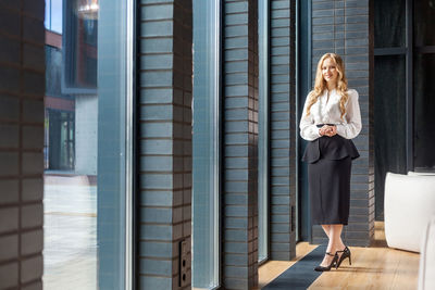 Woman standing at office building