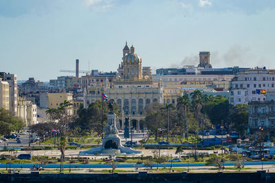 Buildings in city against sky