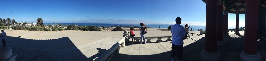 Panoramic view of beach against blue sky