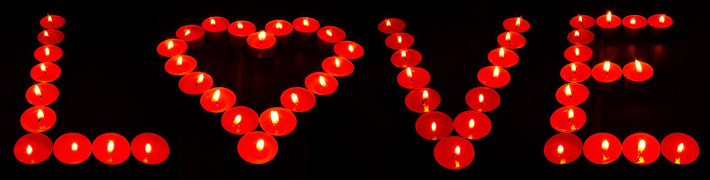 Close-up of illuminated lanterns hanging at night
