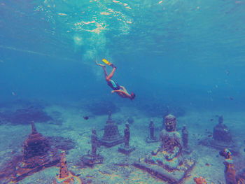 Snorkeling at the underwater buddha temple in bali.