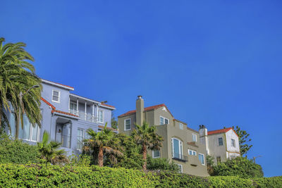 Low angle view of building against clear blue sky