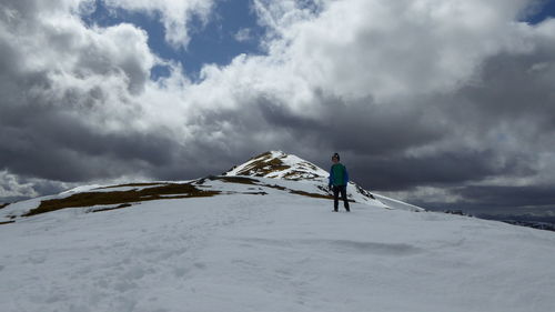 Low angle view of people in cloudy sky