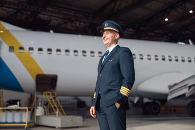 Rear view of man standing on airport