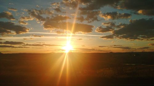 Scenic view of landscape against sky during sunset