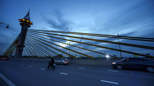 View of bridge against cloudy sky