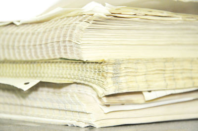 Close-up of paper stacked on table