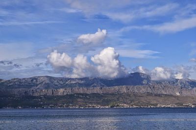 Scenic view of lake with mountains in background