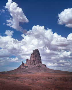 Rock mountain on landscape against sky