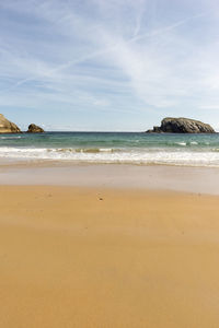 Scenic view of beach against sky