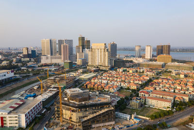 High angle view of buildings in city against clear sky