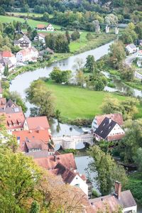 High angle view of townscape by trees