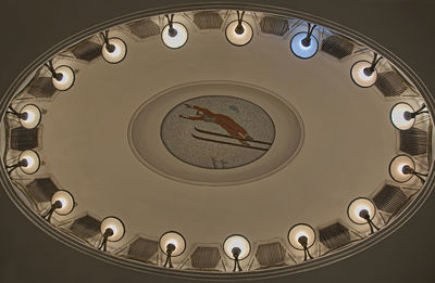 Low angle view of clock on ceiling in building