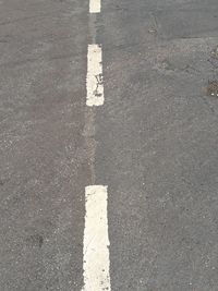 High angle view of arrow sign on road