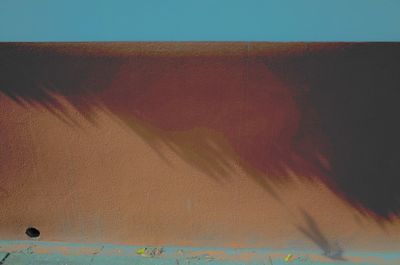 Close-up of sand against sky