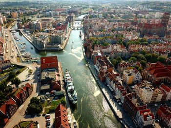 High angle view of river amidst buildings in city