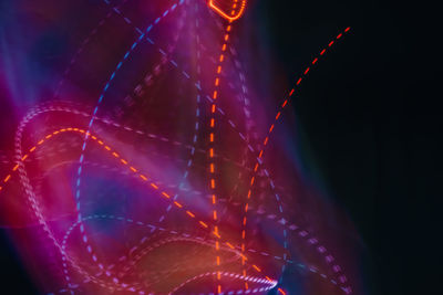 Close-up of light painting against black background